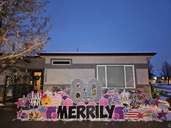 An image of a yard sign with a big number 80, the phrase "Happy Birthday Merrily" and other graphics around it.